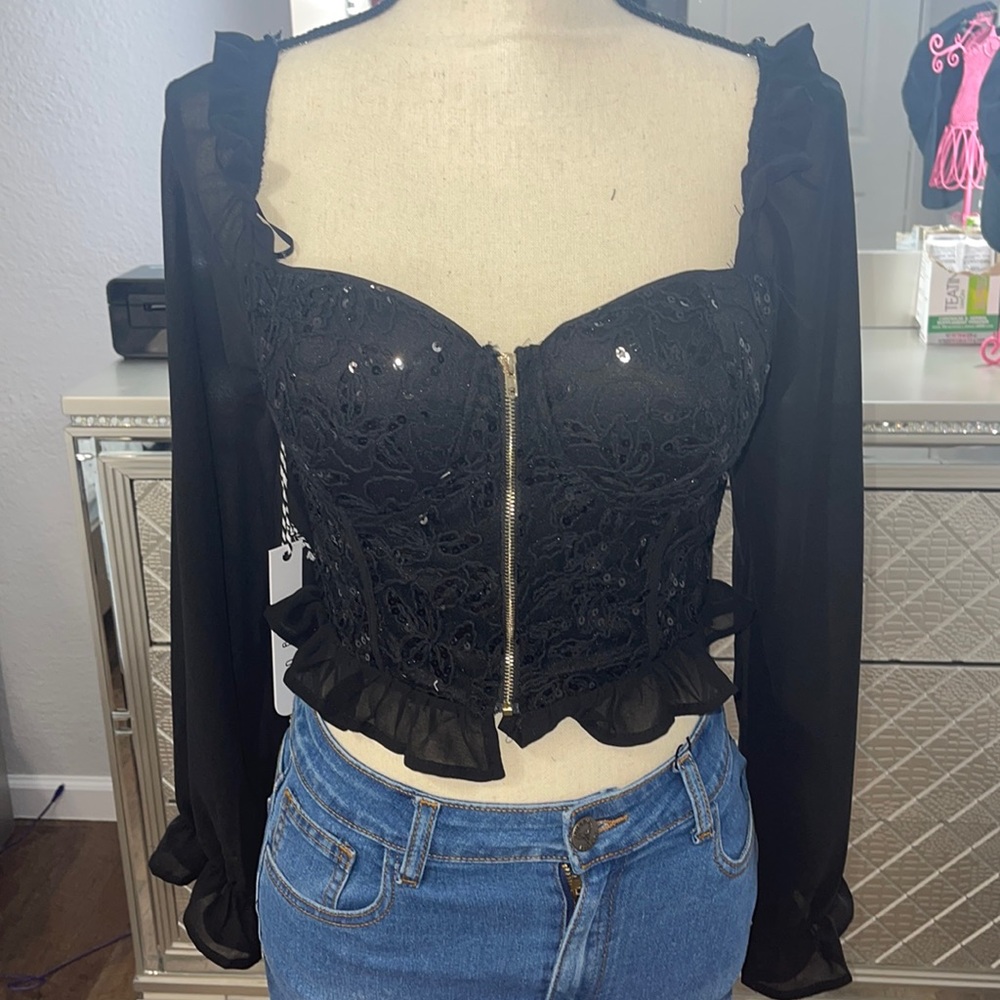 Story on long sleeve black top